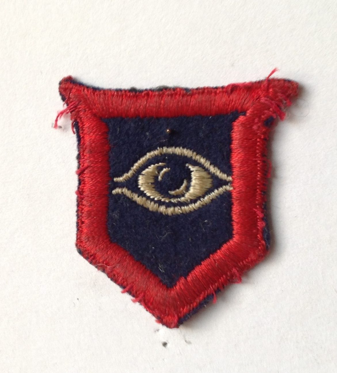 The Guards Armoured Division (GAD) sign, a red outline with an eye in the middle.