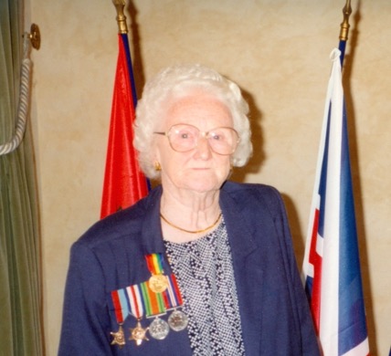 Robert's wife Elsie pictured wearing Robert's medals on the 50th anniversary of D-Day